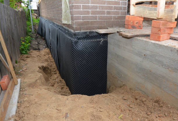 Happy homeowners after waterproofing job in Grandville